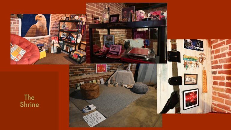 A digitally compiled image of an installation features a shelving unit filled with books, pictures, and various trinkets. A picture of a bald eagle hangs on the wall. On the door to the exhibit, keys are hanging, with a Dallas Cowboys poster above them. Below the poster, there is a photograph frame displaying a two-dollar bill, along with another framed photograph at the bottom. In the bottom center, a picture of a "Take Your Shoes Off" sign is visible next to a carpet. On the carpet, there appears to be a stool of some kind, and in the far right corner of the room, an altar is present. The words "The Shrine" are written in yellow lettering on the left, and everything is set against a red backdrop.