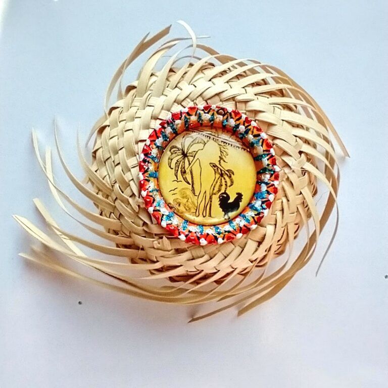 Graphic illustration, enamel, epoxy, bottle cap, mounted on miniature woven Puerto Rican campesino hat.
