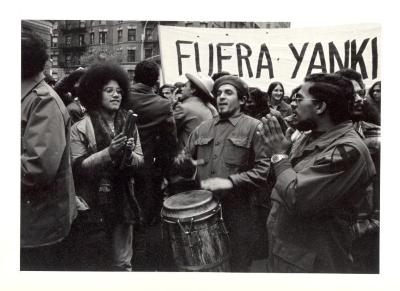 Protest with sign that reads "Fuera Yanki" (Get Out Yankee)