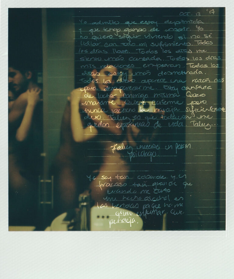Two people standing in a bathroom nude, pressed together back to front. Lines are drawn on the photograph to make space for a wall of handwritten text.