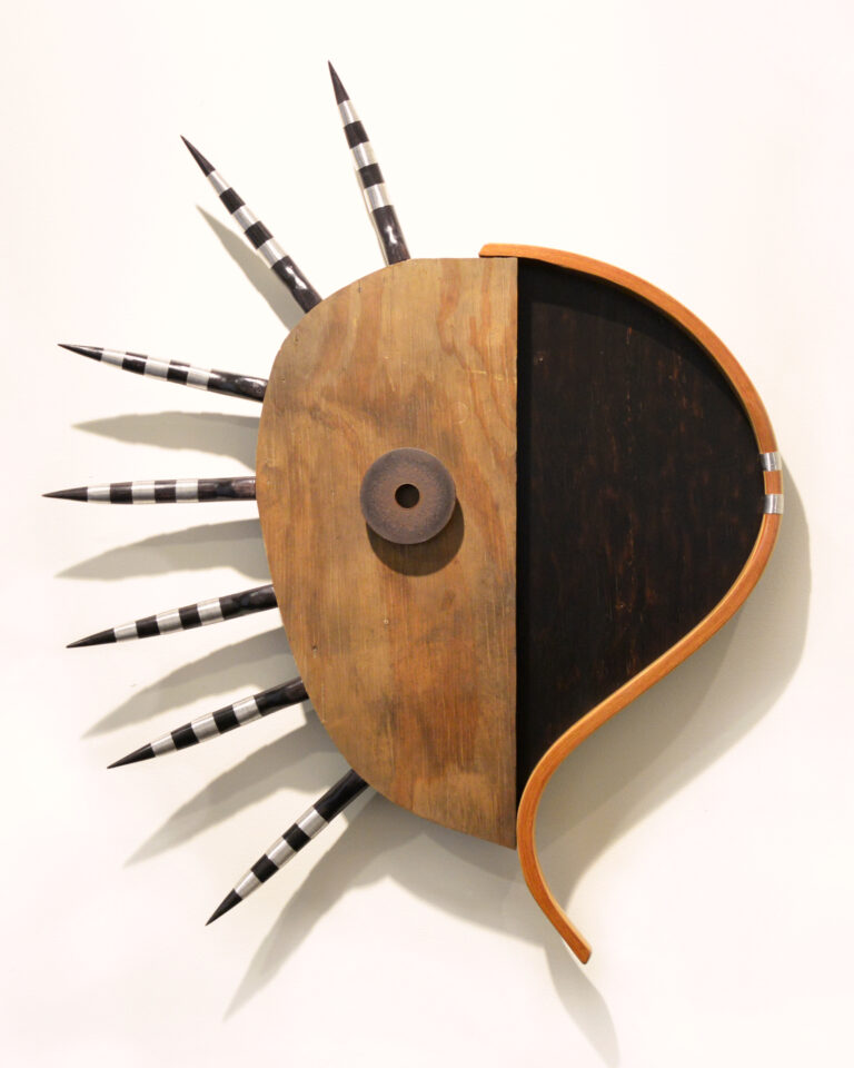 "Sculpture, hand carved wood, plywood, part of a rocking chair, found object and welding wire. I collect objects and parts of furniture from the streets between my house and studio. Then I begin to design the work guided by the shapes of these objects. From series: Amuletos" - Josué Guarionex