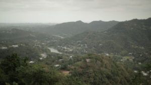 Foggy landscape over mountains and hills.