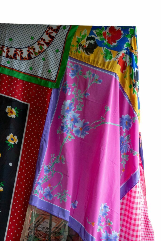 Detail of one headscarf made with a pink and purple floral pattern