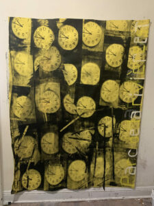 Silkscreens of yellow clocks overlapping each other. Reads "Parc de la Rivière."