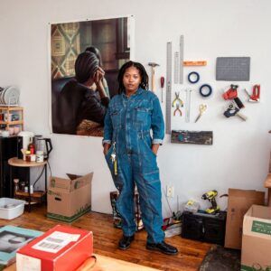 Artist Andina Marie Osorio stands in her studio.