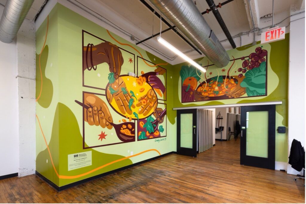 Mural of people cooking. Food is in spoons and bowls.