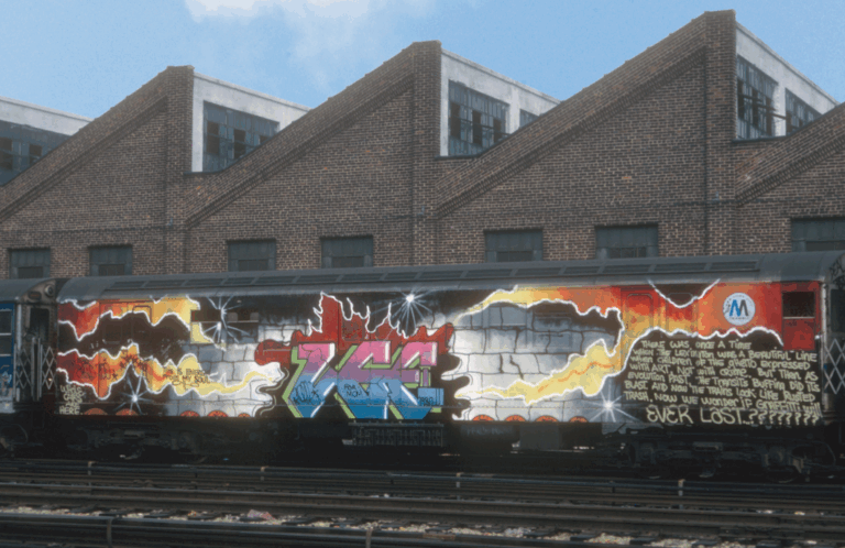 Train car decorated with spray paint. The image shows "LEE" and vibrant cracks in the train. There is text about the future of art.
