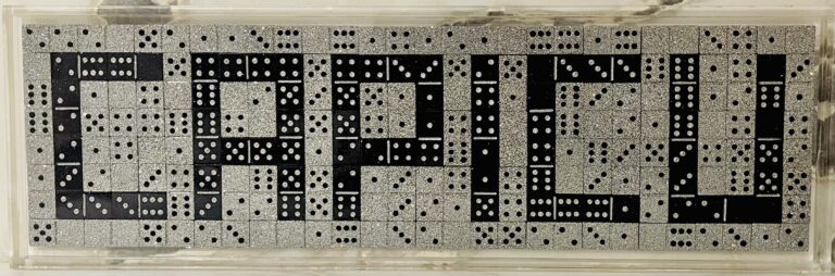 Dominoes in black with white pips arranged to spell "Capicu" set within grey dominoes with black pips to create a rectangle.