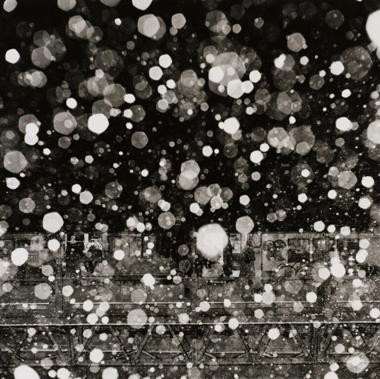The NYC MTA Subway behind abstracted falling snow.