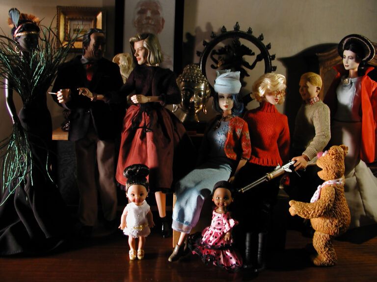 An assortment of figural dolls, from realistic to Fozzy Bear, crowded in mock conversation.