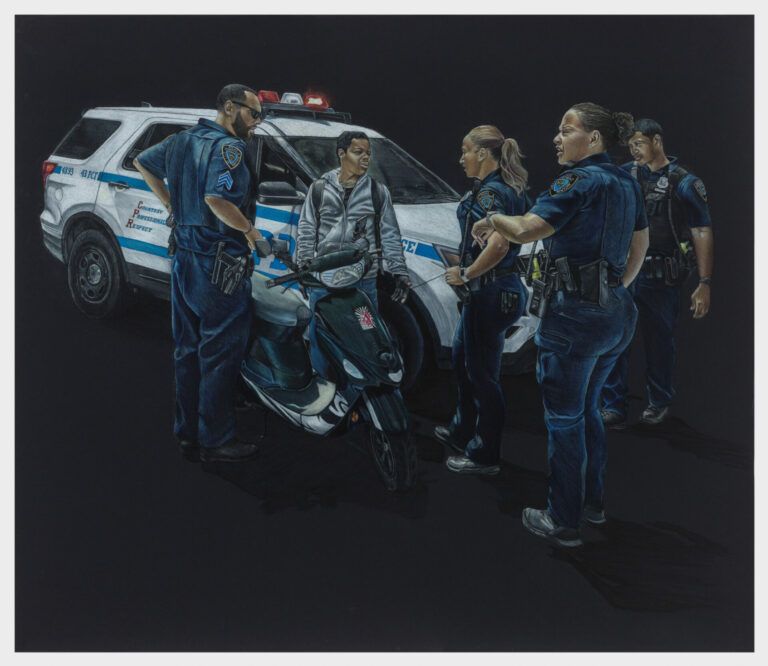 A group of police officers surrounds a young person on a bike.
